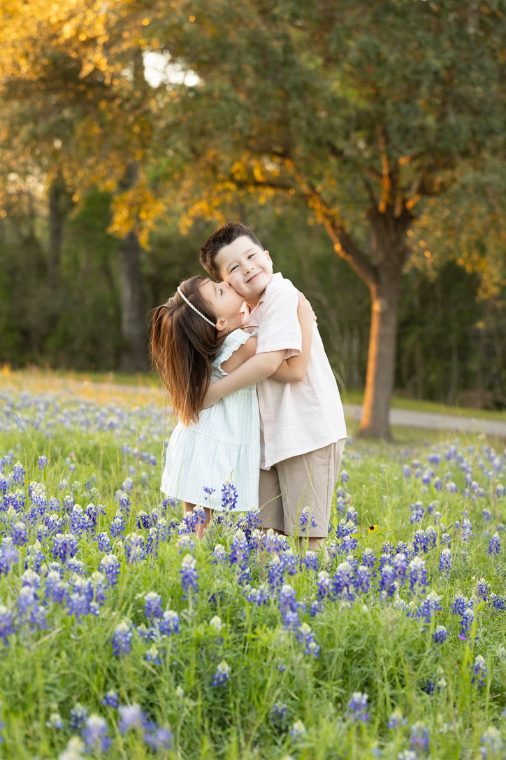 Cy and his sister in the bluebonnets